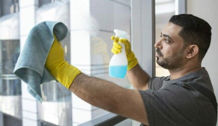 medium-shot-man-cleaning-office-window medium-shot-man-cleaning-office-window
